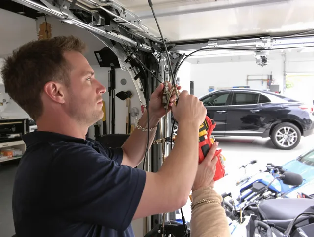Macedonia Garage Door Repair safety certified technician performing cable replacement in Macedonia