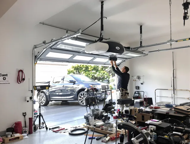 Macedonia Garage Door Repair specialist installing smart garage door opener system in Macedonia home