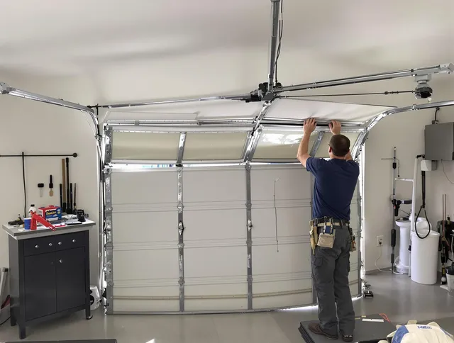 Macedonia Garage Door Repair specialist performing precise section replacement on Macedonia garage door